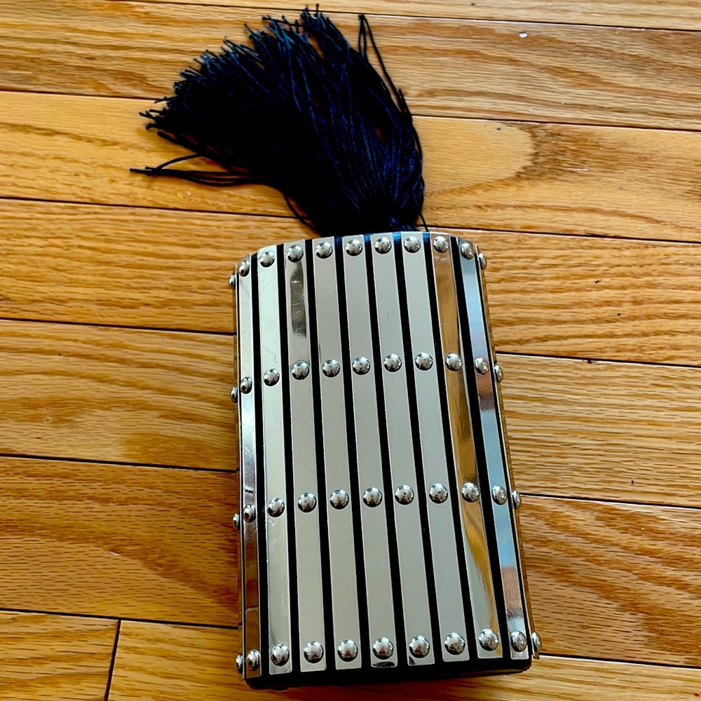 A clutch…clutch! Goes with everything and fits what you need it to. Gently worn